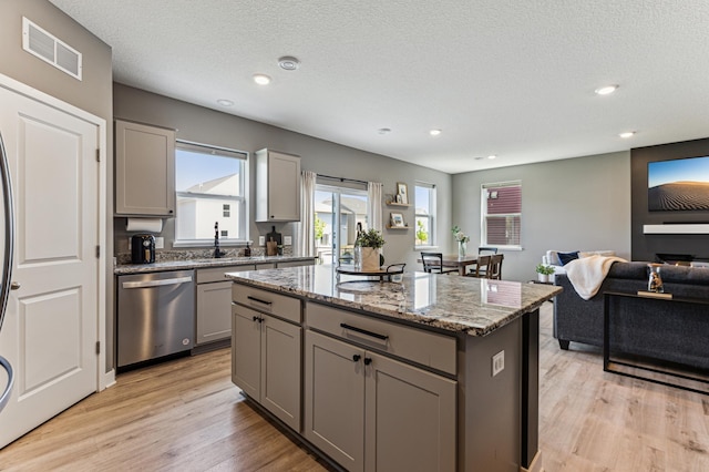 12719 Erskin St NE, Blaine, MN 55449 - kitchen featuring dishwasher, gray cabinets, a center island, light wood-type flooring, and recessed lighting