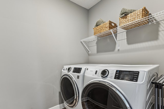 12719 Erskin St NE, Blaine, MN 55449 - laundry room with independent washer and dryer and baseboards