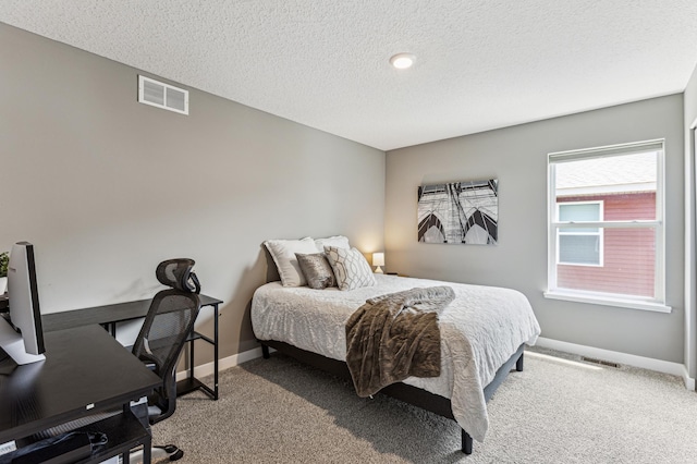 12719 Erskin St NE, Blaine, MN 55449 - carpeted bedroom with baseboards, a textured ceiling, and an office area