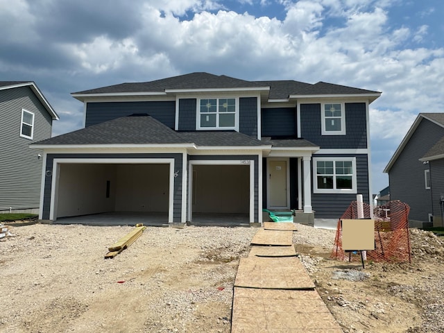 14538 Kingsview Ln N, Dayton, MN 55327 - view of front of property featuring a garage, a shingled roof, and driveway