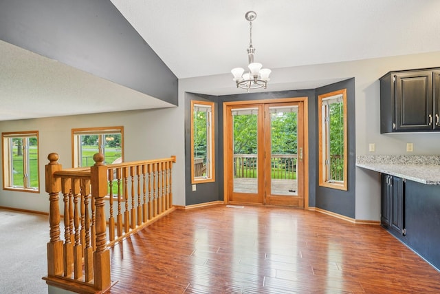 1504 Monarch St, Shakopee, MN 55379 - foyer entrance featuring a chandelier, light wood-style flooring, and vaulted ceiling