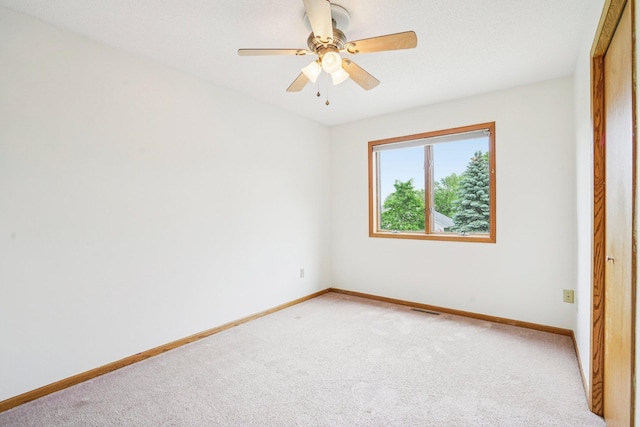 1504 Monarch St, Shakopee, MN 55379 - unfurnished bedroom featuring light carpet and ceiling fan
