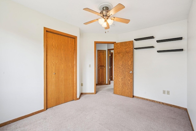 1504 Monarch St, Shakopee, MN 55379 - unfurnished bedroom with light carpet, a closet, and a ceiling fan