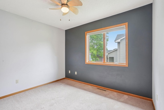 1504 Monarch St, Shakopee, MN 55379 - carpeted empty room featuring a ceiling fan and baseboards