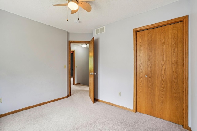 1504 Monarch St, Shakopee, MN 55379 - unfurnished bedroom with light colored carpet, a closet, and ceiling fan