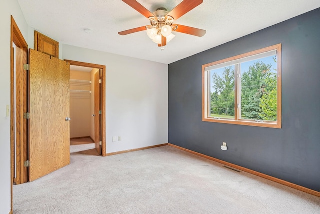 1504 Monarch St, Shakopee, MN 55379 - carpeted spare room featuring a ceiling fan and a smoke detector
