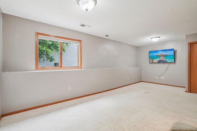 1504 Monarch St, Shakopee, MN 55379 - carpeted empty room with a textured ceiling