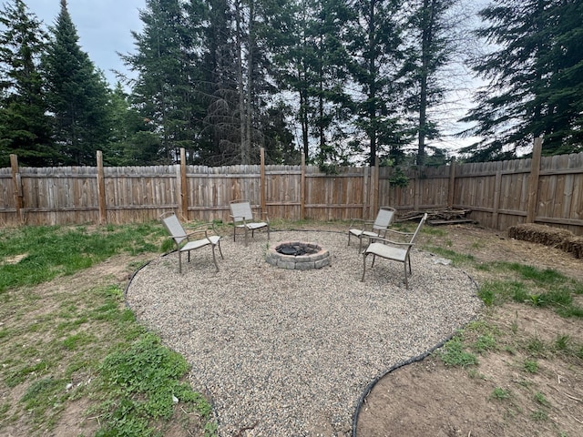 1101 Timbers Dr, Park Rapids, MN 56470 - fenced backyard with a fire pit