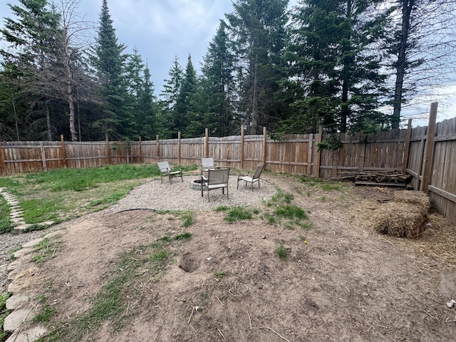 1101 Timbers Dr, Park Rapids, MN 56470 - fenced backyard featuring an outdoor fire pit