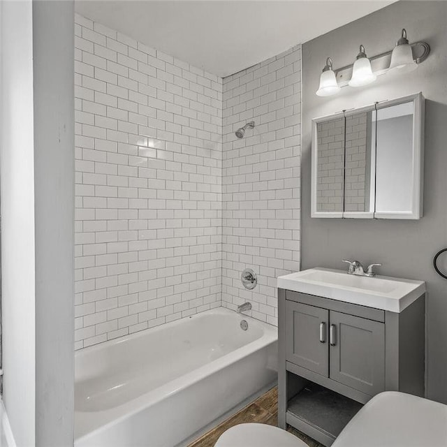 608 Beaumont St, Saint Paul, MN 55130 - bathroom with toilet, vanity, and shower / bathtub combination