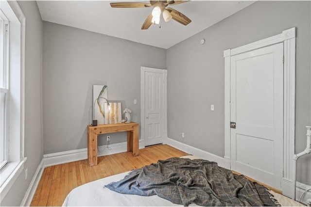 608 Beaumont St, Saint Paul, MN 55130 - bedroom with light wood-type flooring, baseboards, and ceiling fan