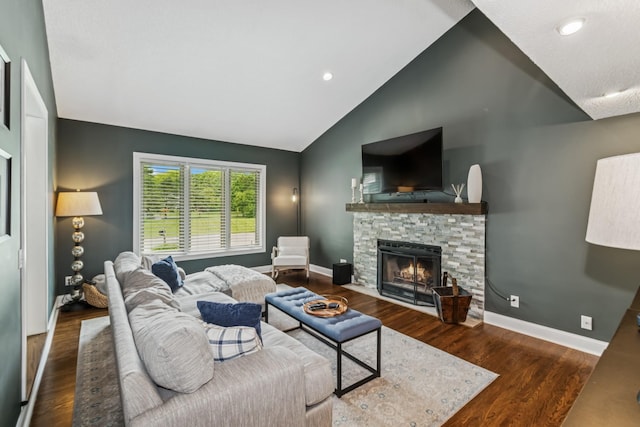 3720 Ximines Ln N, Plymouth, MN 55441 - living room featuring a stone fireplace, vaulted ceiling, wood finished floors, and recessed lighting