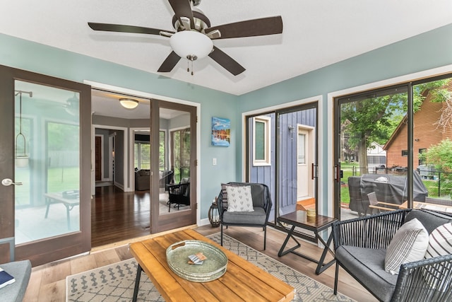 3720 Ximines Ln N, Plymouth, MN 55441 - living area featuring plenty of natural light, a ceiling fan, and wood finished floors