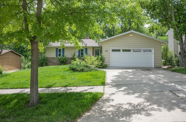 324 Meadow Run Dr SW, Rochester, MN 55902 - single story home featuring concrete driveway, a front lawn, a garage, and a chimney