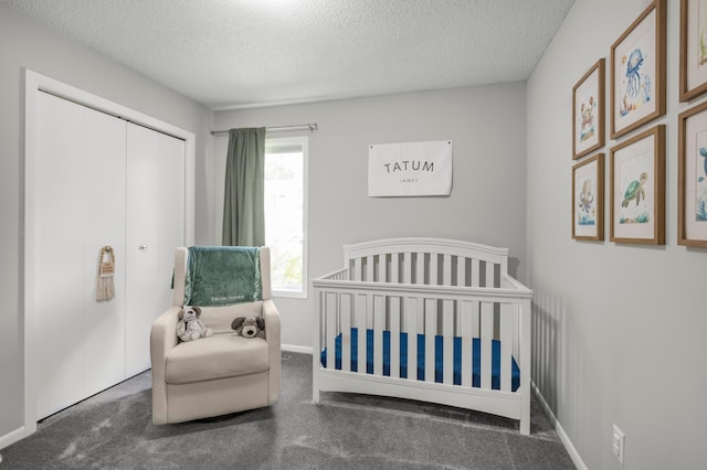 324 Meadow Run Dr SW, Rochester, MN 55902 - carpeted bedroom featuring a textured ceiling, a closet, baseboards, and a nursery area