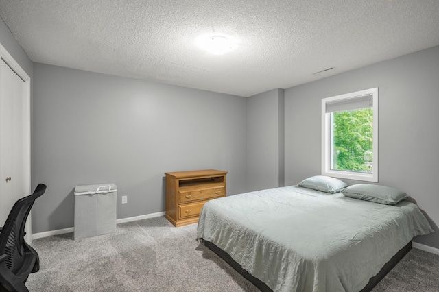 324 Meadow Run Dr SW, Rochester, MN 55902 - bedroom featuring a textured ceiling, carpet, baseboards, and a closet