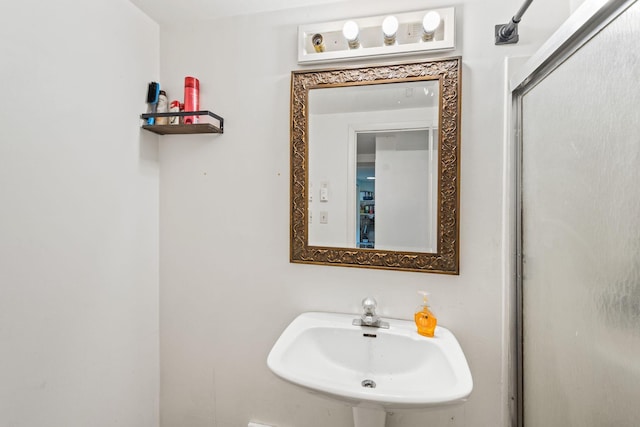 2065 124th Ln NW, Coon Rapids, MN 55448 - bathroom with a sink and an enclosed shower