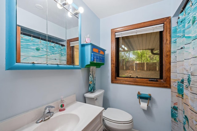 2065 124th Ln NW, Coon Rapids, MN 55448 - full bathroom with toilet, vanity, and curtained shower
