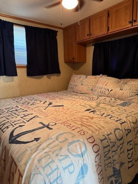 2221 Reubens Ln SW Unit 20, Farwell, MN 56327 - bedroom with a ceiling fan