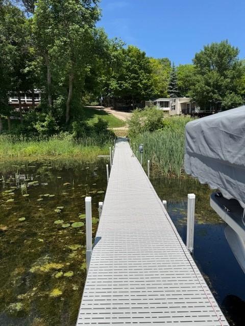 2221 Reubens Ln SW Unit 20, Farwell, MN 56327 - dock with a water view and view of wooded area