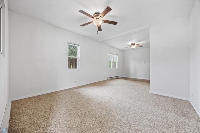 406 4th Ave NW, Barnesville, MN 56514 - spare room featuring a baseboard heating unit, a ceiling fan, baseboards, and carpet floors