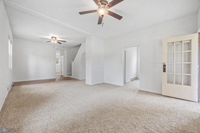 406 4th Ave NW, Barnesville, MN 56514 - carpeted spare room with a ceiling fan, baseboards, and a baseboard heating unit