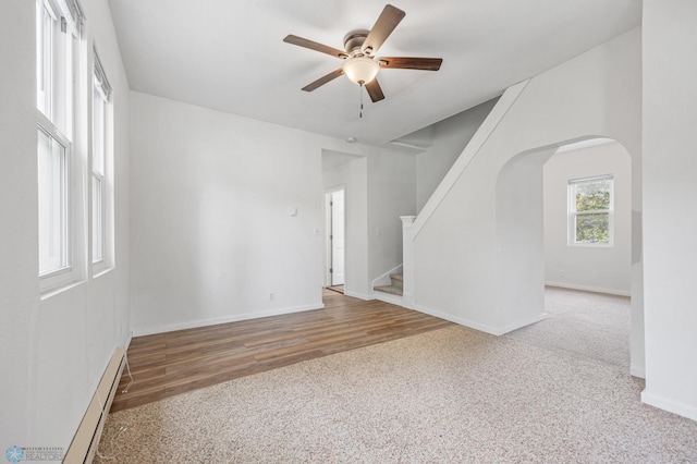 406 4th Ave NW, Barnesville, MN 56514 - empty room with a ceiling fan, arched walkways, stairs, and baseboards