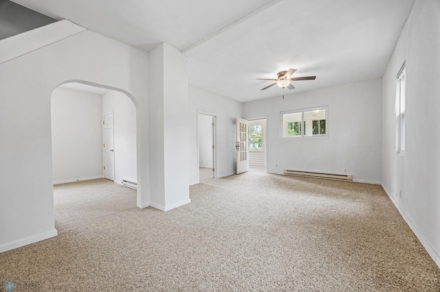 406 4th Ave NW, Barnesville, MN 56514 - carpeted spare room featuring baseboard heating, ceiling fan, arched walkways, and baseboards