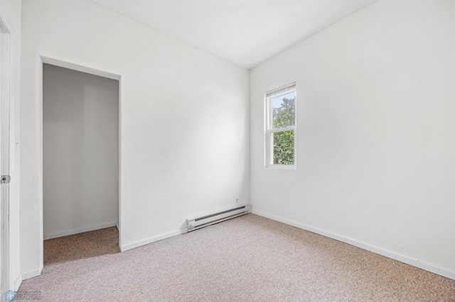 406 4th Ave NW, Barnesville, MN 56514 - unfurnished bedroom featuring baseboard heating, carpet flooring, and baseboards