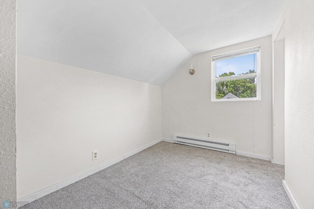 406 4th Ave NW, Barnesville, MN 56514 - bonus room featuring a baseboard radiator, vaulted ceiling, carpet floors, and baseboards