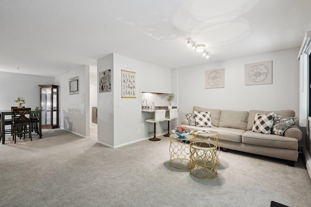 5697 Green Circle Dr Unit 216, Minnetonka, MN 55343 - carpeted living area featuring baseboards