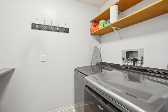 5697 Green Circle Dr Unit 216, Minnetonka, MN 55343 - washroom with washing machine and clothes dryer and baseboards