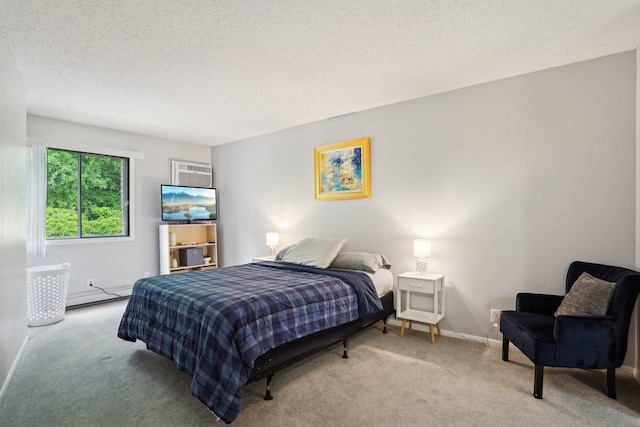 5697 Green Circle Dr Unit 216, Minnetonka, MN 55343 - carpeted bedroom featuring a baseboard heating unit, a textured ceiling, baseboards, and a wall mounted air conditioner