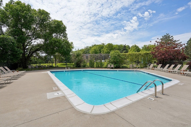 5697 Green Circle Dr Unit 216, Minnetonka, MN 55343 - community pool featuring a patio area and view of scattered trees