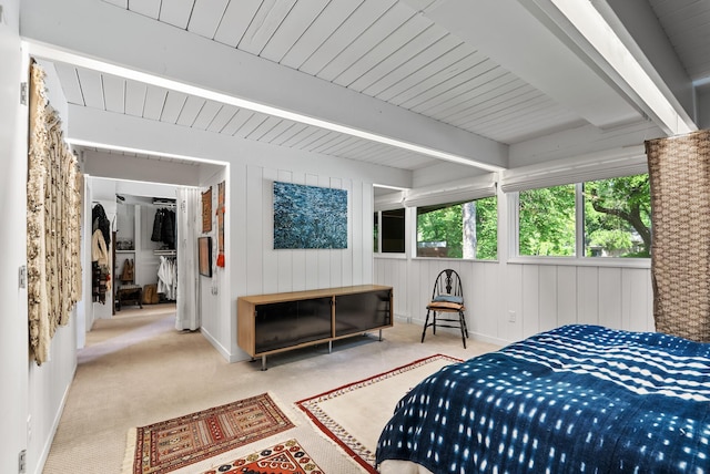 2867 Burnham Blvd, Minneapolis, MN 55416 - bedroom with carpet flooring, wood ceiling with exposed beams, wood walls, a walk in closet, and baseboards