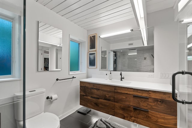 2867 Burnham Blvd, Minneapolis, MN 55416 - full bathroom featuring baseboards, vanity, a shower stall, toilet, and tile patterned floors