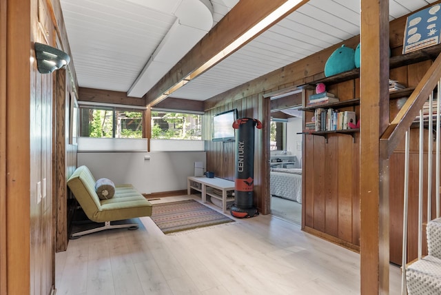 2867 Burnham Blvd, Minneapolis, MN 55416 - sitting room featuring wood finished floors, wood walls, and baseboards