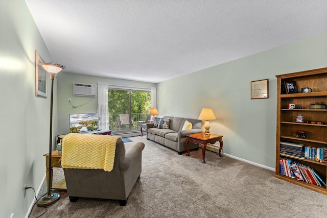 183 Little Canada Rd E Unit 310, Little Canada, MN 55117 - living area featuring a wall unit AC, carpet flooring, a textured ceiling, and baseboards