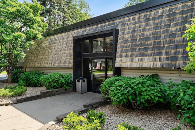 183 Little Canada Rd E Unit 310, Little Canada, MN 55117 - property entrance with mansard roof