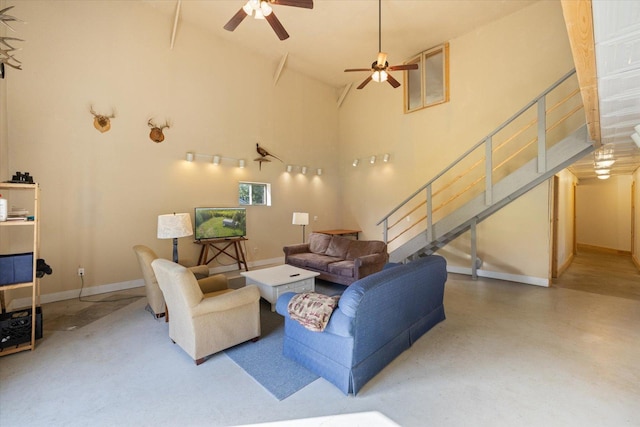 11556 Blackwood Rd, Floodwood Twp, MN 55736 - living area with a ceiling fan, stairway, high vaulted ceiling, and baseboards