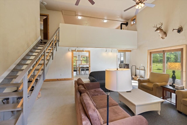 11556 Blackwood Rd, Floodwood Twp, MN 55736 - carpeted living area with ceiling fan, high vaulted ceiling, stairway, and rail lighting