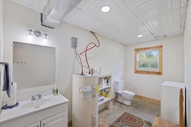 11556 Blackwood Rd, Floodwood Twp, MN 55736 - bathroom with electric water heater, vanity, toilet, concrete flooring, and baseboards