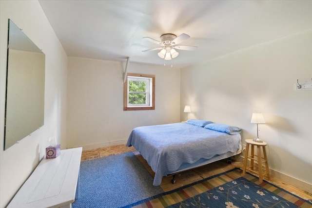 11556 Blackwood Rd, Floodwood Twp, MN 55736 - bedroom with baseboards, ceiling fan, and wood finished floors