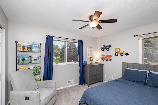 2205 Valders Ave N, Golden Valley, MN 55427 - bedroom with light carpet and a ceiling fan