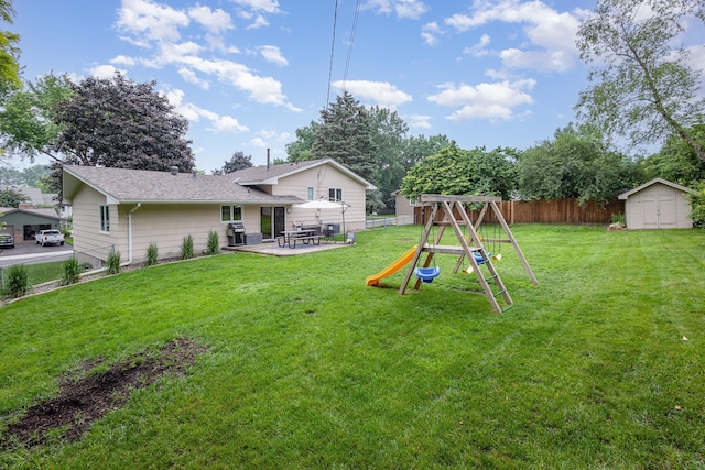 2205 Valders Ave N, Golden Valley, MN 55427 - fenced backyard with a storage shed, a playground, and a patio