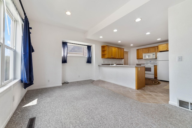 601 22nd Ave W, Duluth, MN 55806 - kitchen featuring white appliances, light carpet, recessed lighting, a peninsula, and open shelves