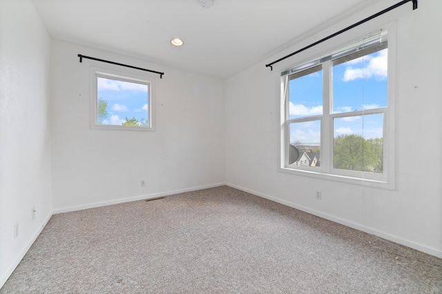 601 22nd Ave W, Duluth, MN 55806 - empty room with plenty of natural light, carpet floors, baseboards, and recessed lighting