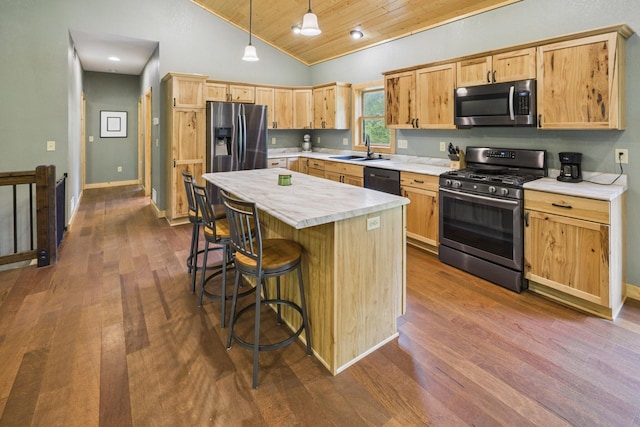 1268 Nellie Lake Ln NE, Longville, MN 56655 - kitchen featuring appliances with stainless steel finishes, wood ceiling, a sink, light countertops, and dark wood-type flooring