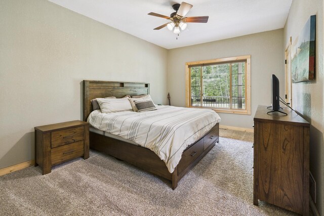 1268 Nellie Lake Ln NE, Longville, MN 56655 - bedroom featuring light carpet, baseboards, and ceiling fan