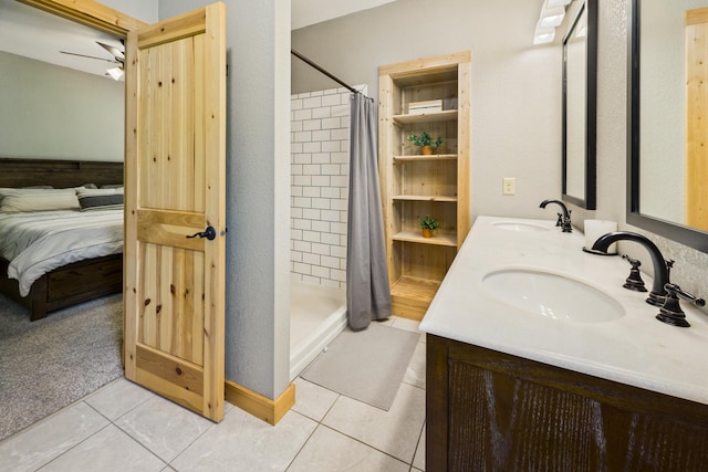 1268 Nellie Lake Ln NE, Longville, MN 56655 - ensuite bathroom with tile patterned floors, a shower stall, double vanity, and ceiling fan